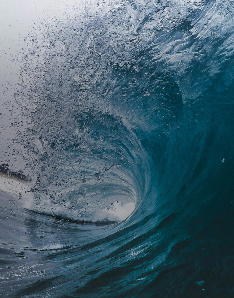 An ocean wave beginning to crash.